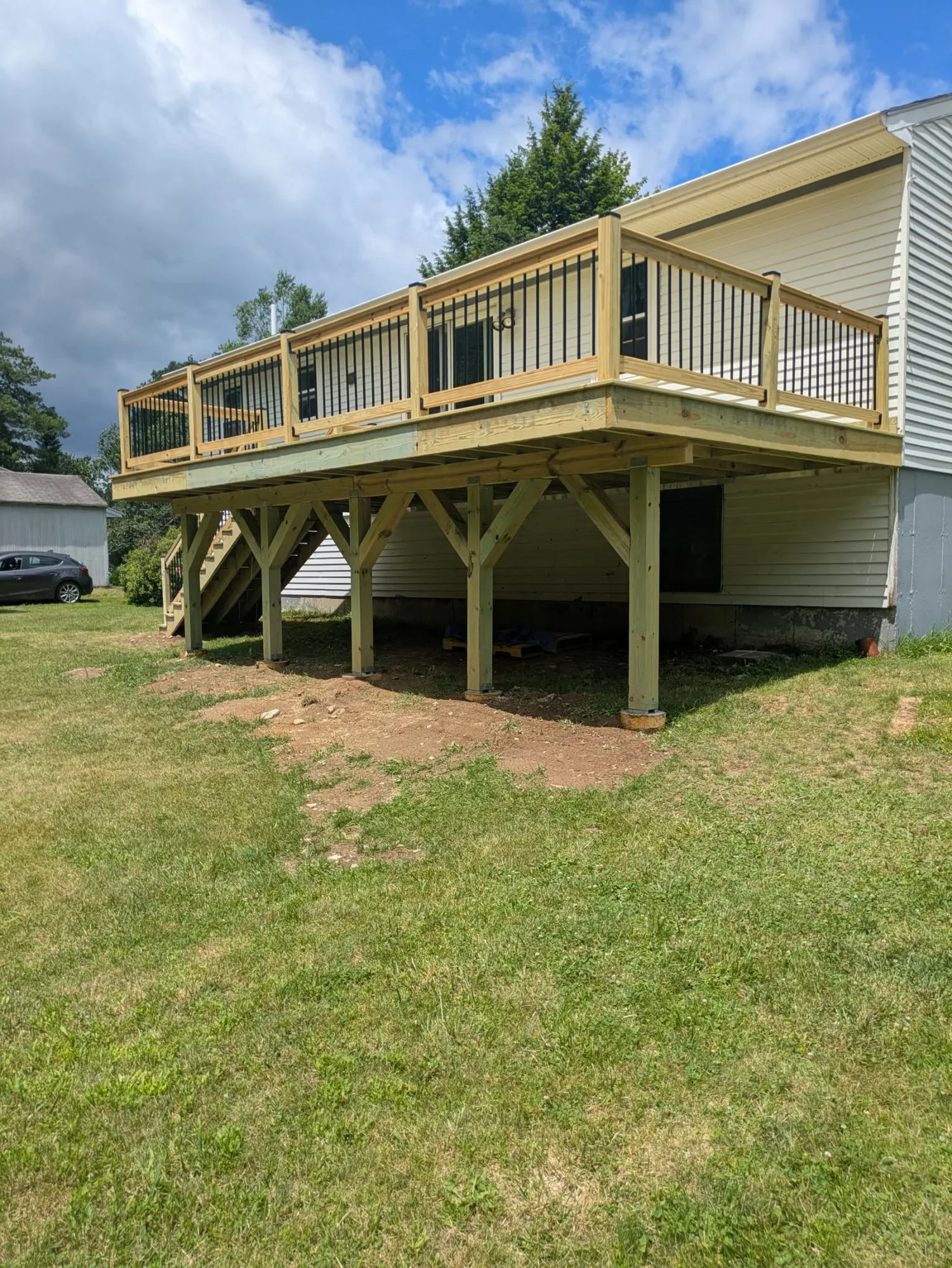 Custom deck by Stronghold Deck Company · Central Maine